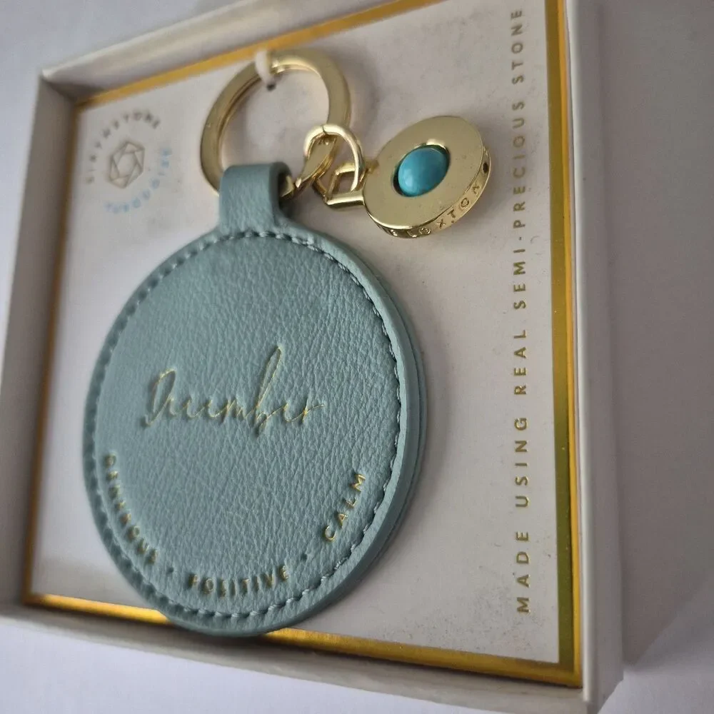 Katie Loxton December Birthstone Generous Positive Calm Round Leather Keychain